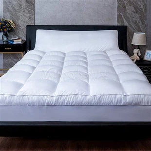 Cubrecolchón para cama de hotel